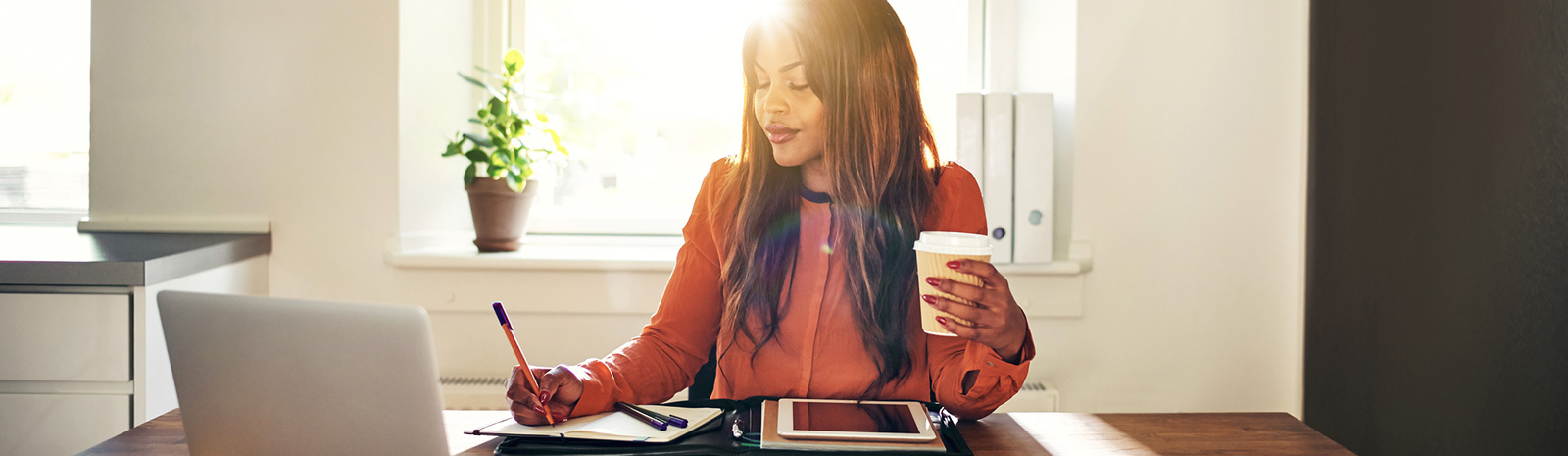 woman at home office going through financials