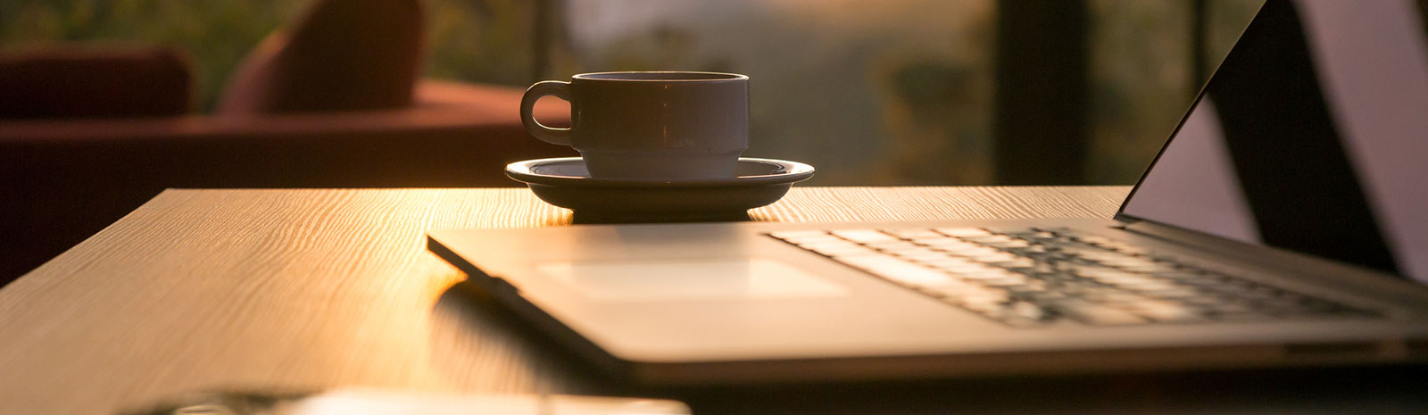 laptop on desk with coffee