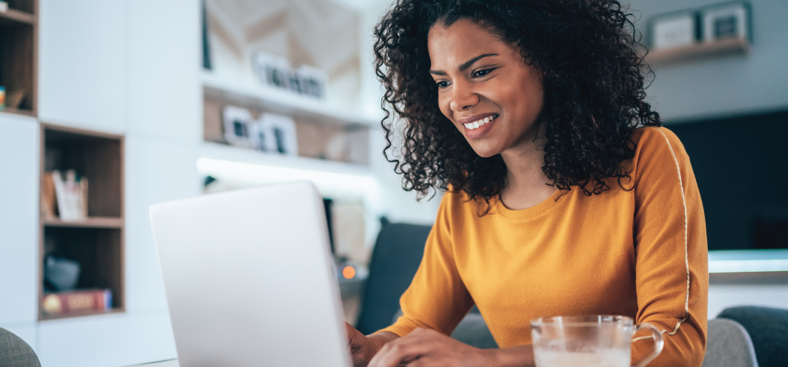 woman utilizing online banking from the comfort of home.